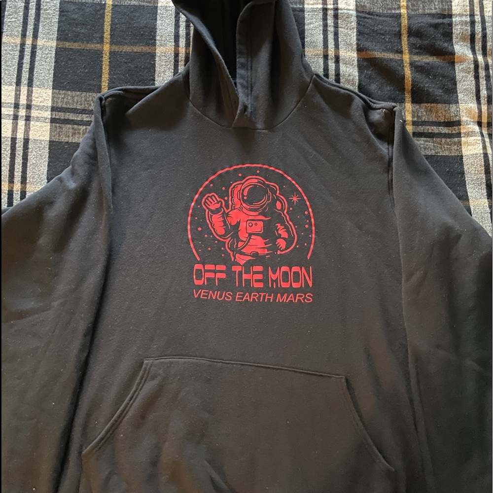 black hoodie with red off the moon graphic design